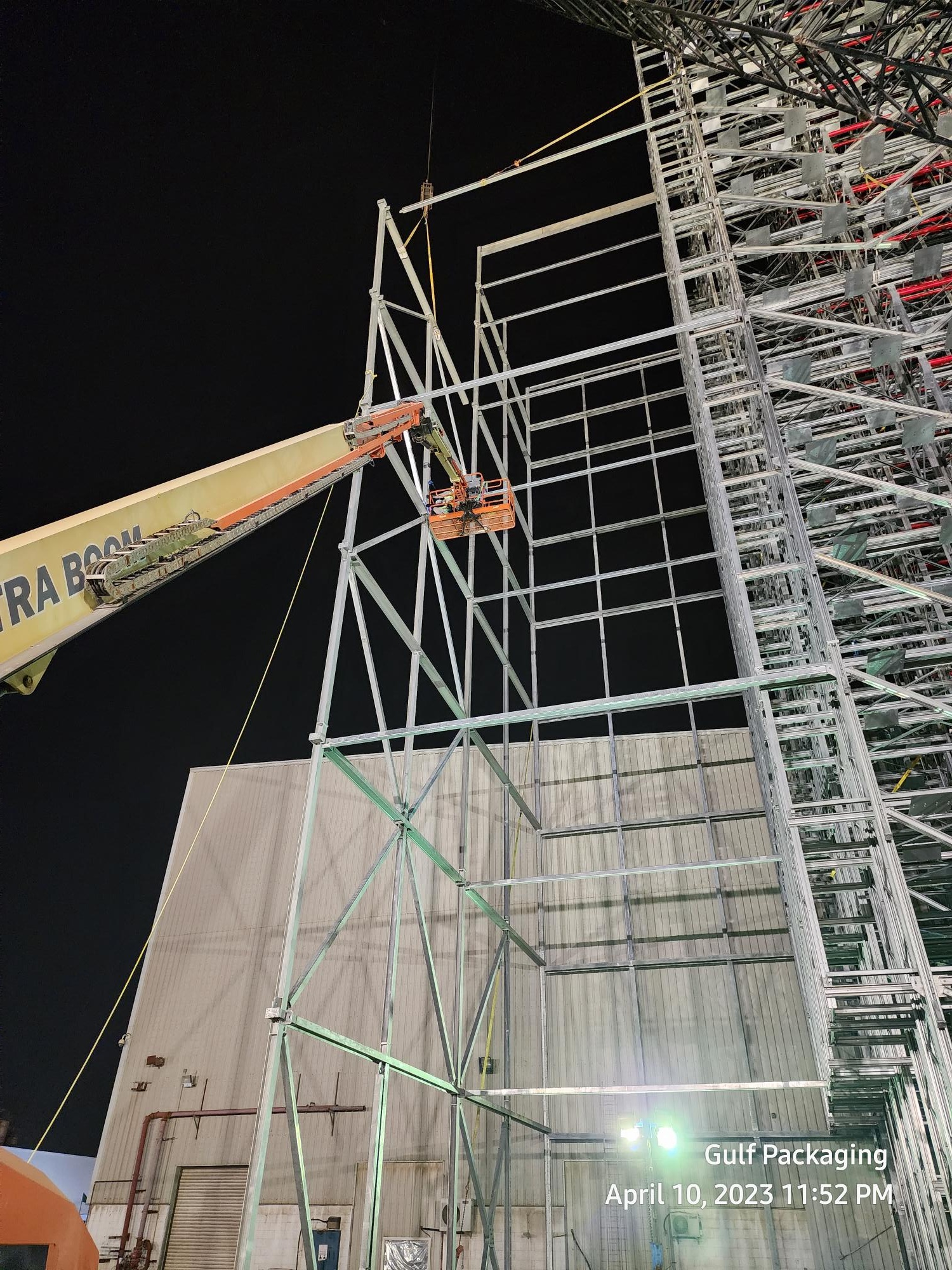 Rack clad structural installation at night